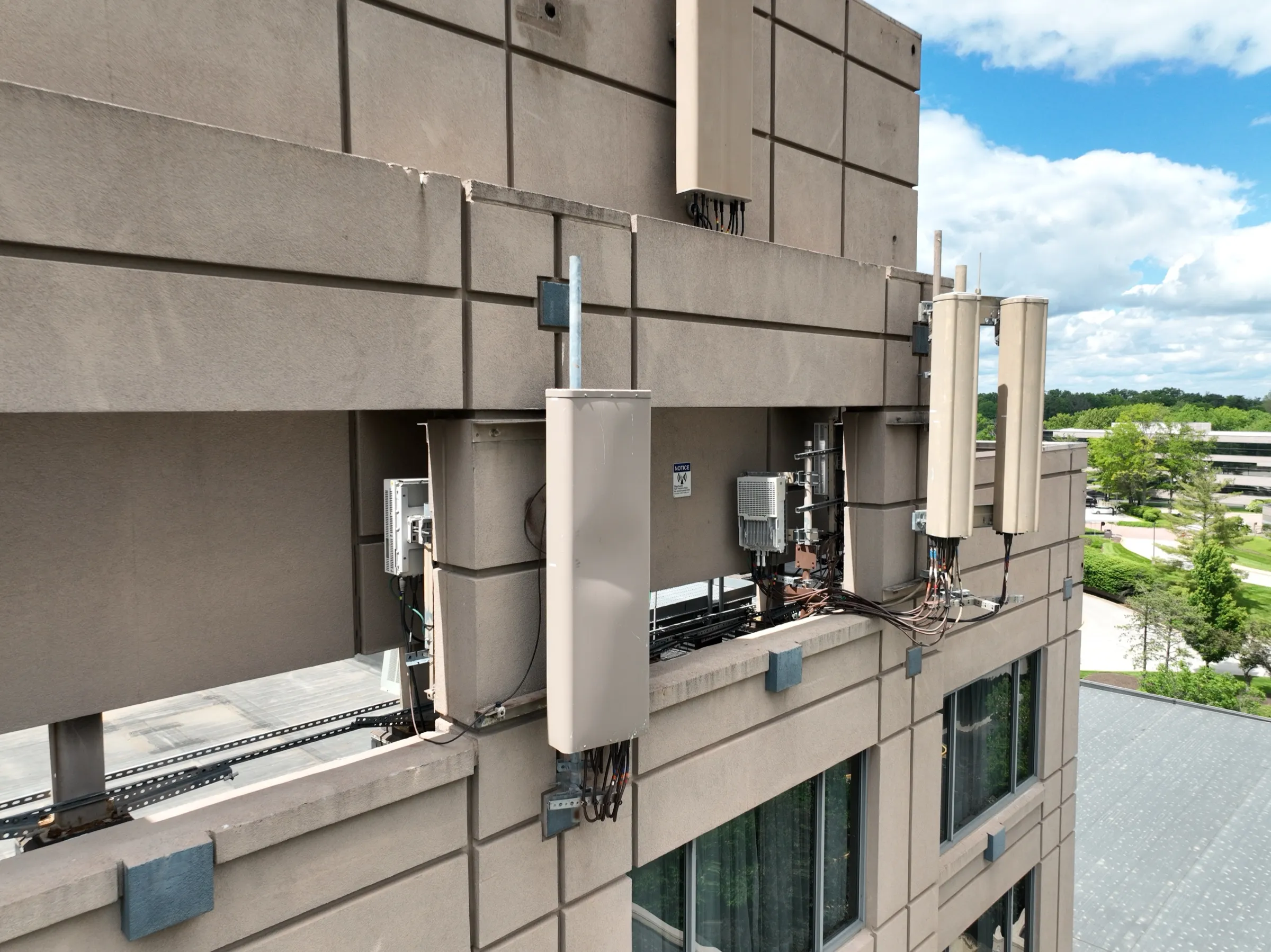 Oblique detail — a closer angle makes mounting hardware, antenna faces and cable runs readable.